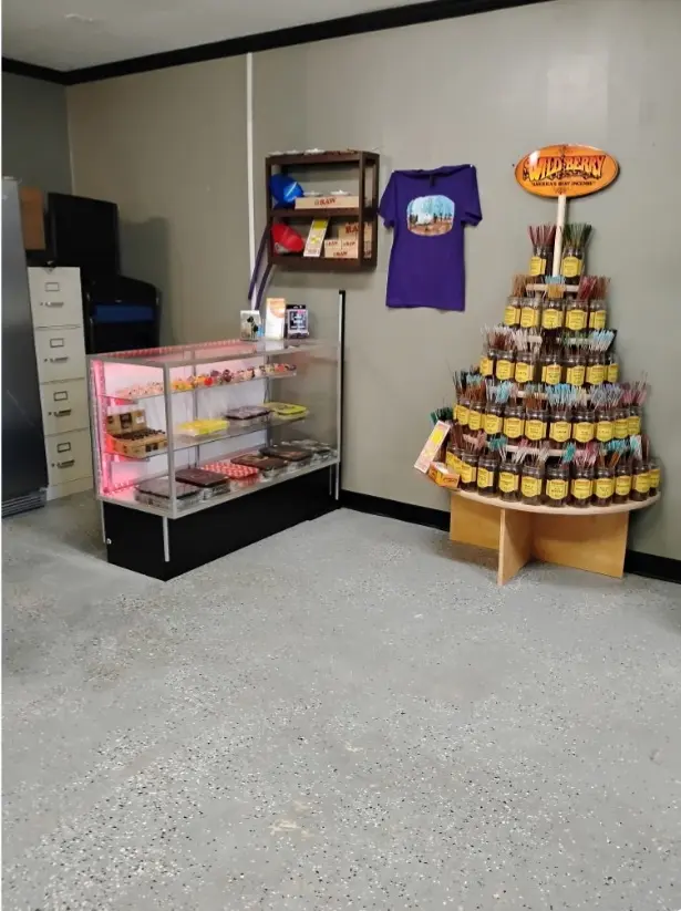 Incense display and bakery products in shop corner.